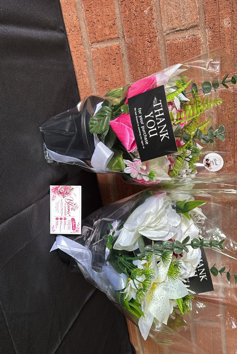 Two wrapped gift posies, one pink and one white, each with a thank-you tag